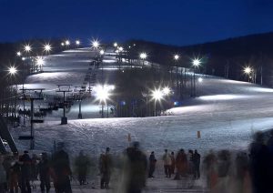 White Lightning Snow Tubing is being enjoyed by people.